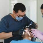 male dentist with patient