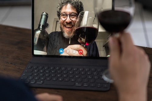 zoom meeting with a glass of red wine